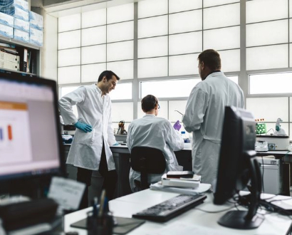 Scientists conducting bacterial analysis in lab setting